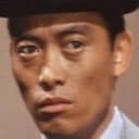 Kazuo Suzuki als Bank Robber Okuda
