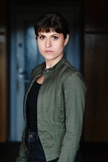 Adrienn Bazso as Interpreter in The Billion Dollar Code