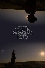 Una mujer con un paraguas roto (2022)