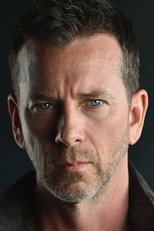 Foto retrato de John Tague