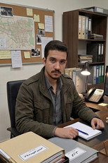 Amir Boozrgan as Senior Security Officer in CALL 404