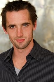 Ryan Higgins as Travis