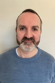 Ian Dillion as Airport Passenger (uncredited)