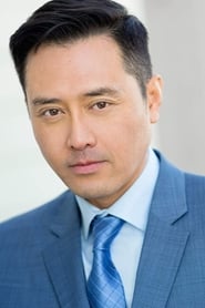 Lawrence Chau as Chinese Newscaster #2