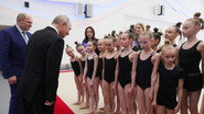 Why is Putin posing with children?