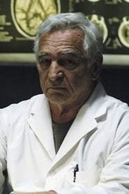 Donnelly Rhodes as Race Official #1