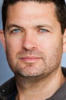 Damien Matthews as Executive