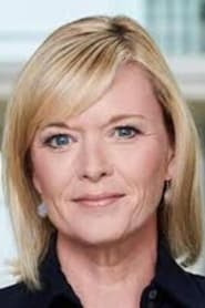 Julie Etchingham as Sky Newsreader