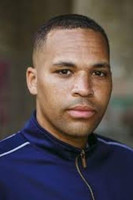 Lamin Touray as Tom Chapman