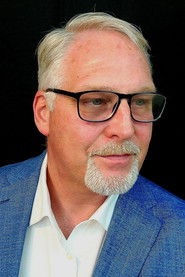 Richard Ingle as Rally Attendee (uncredited)