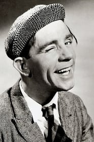 Norman Wisdom as Man Carrying Gnome (uncredited)