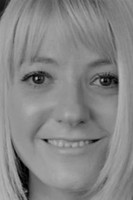 Julie Fernandez as Female Interviewer