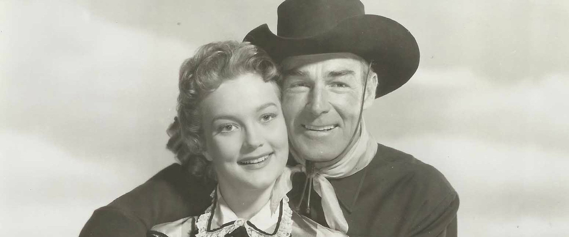 The Man Behind The Gun backdrop