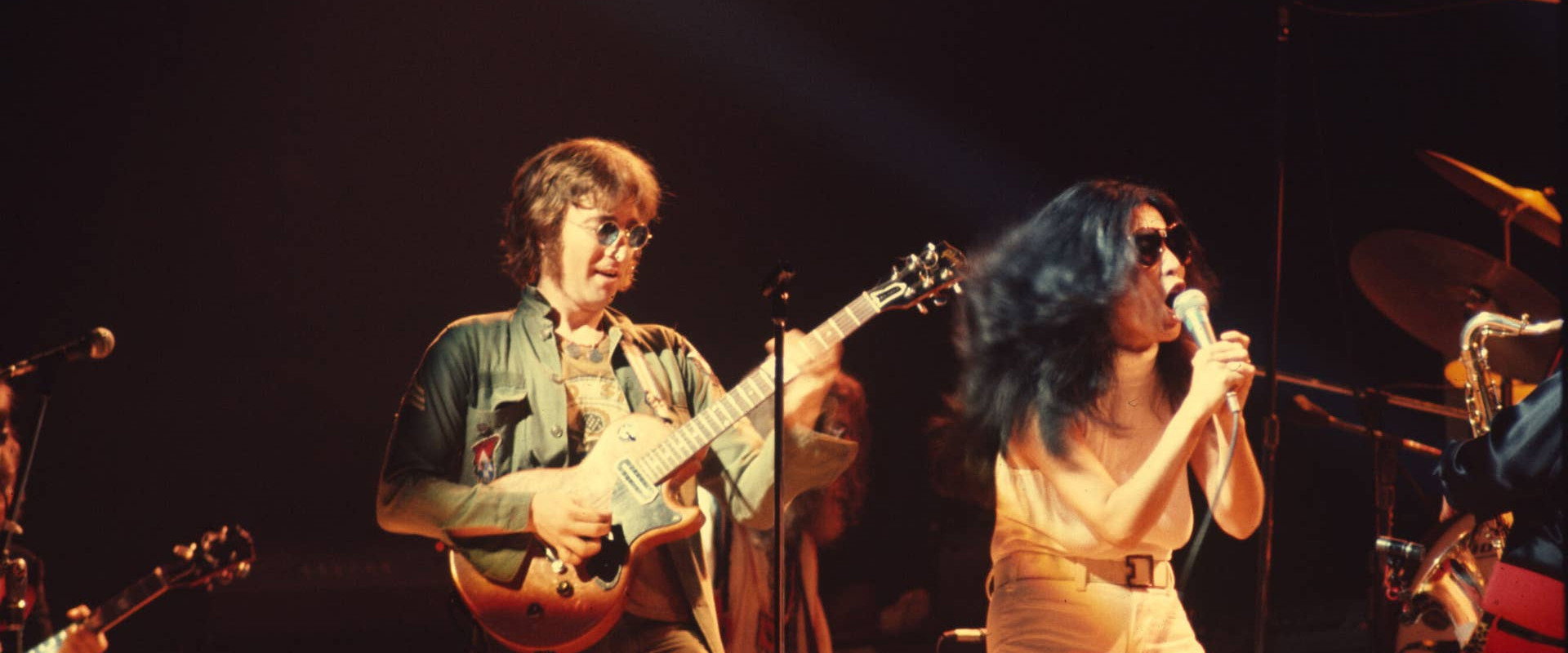 Power to the People: John & Yoko Live in NYC backdrop