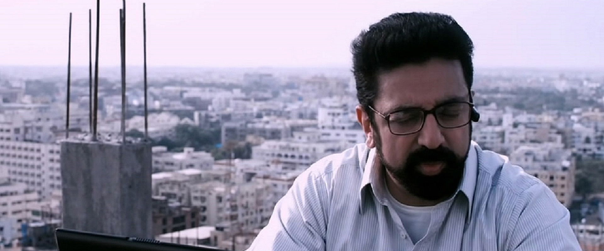 Unnaipol Oruvan backdrop