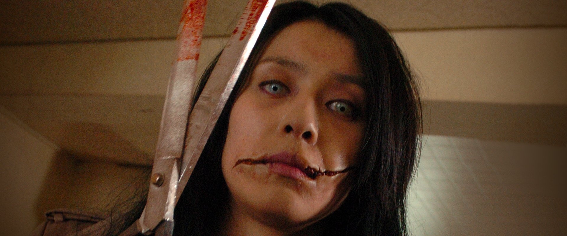 Carved: The Slit-Mouthed Woman backdrop