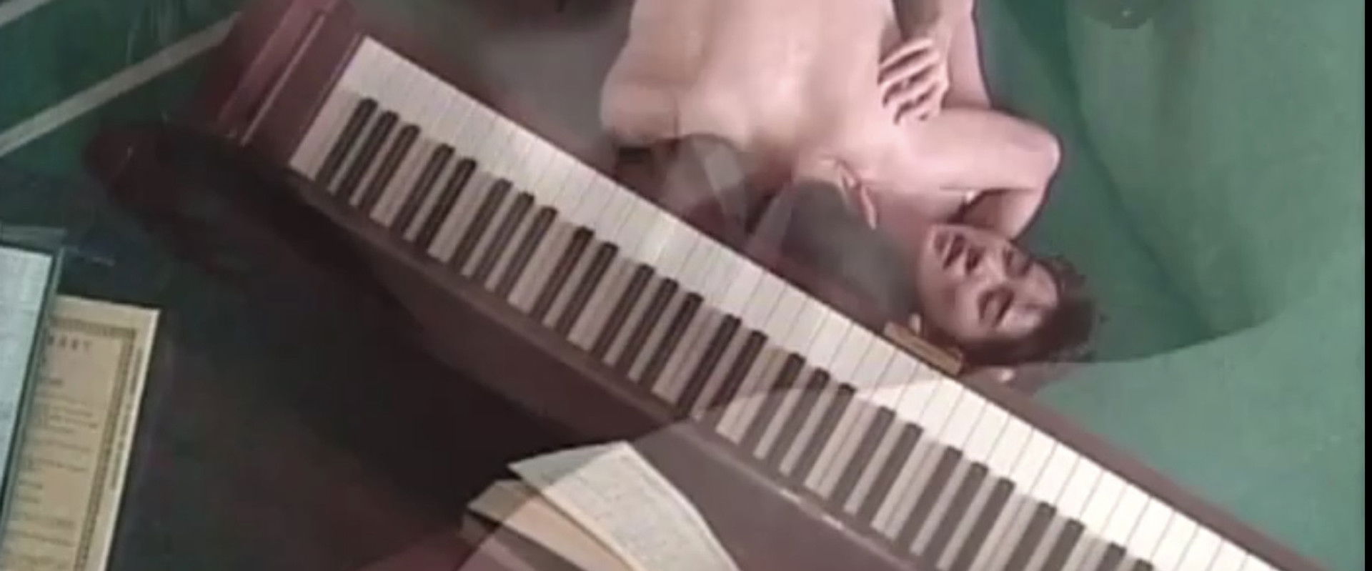 Female Teacher: Under a Wet Piano backdrop