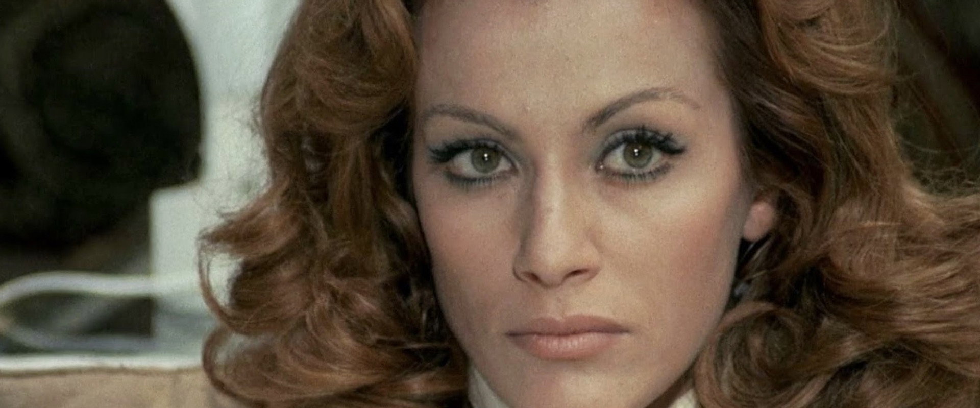 A Lizard in a Woman's Skin backdrop