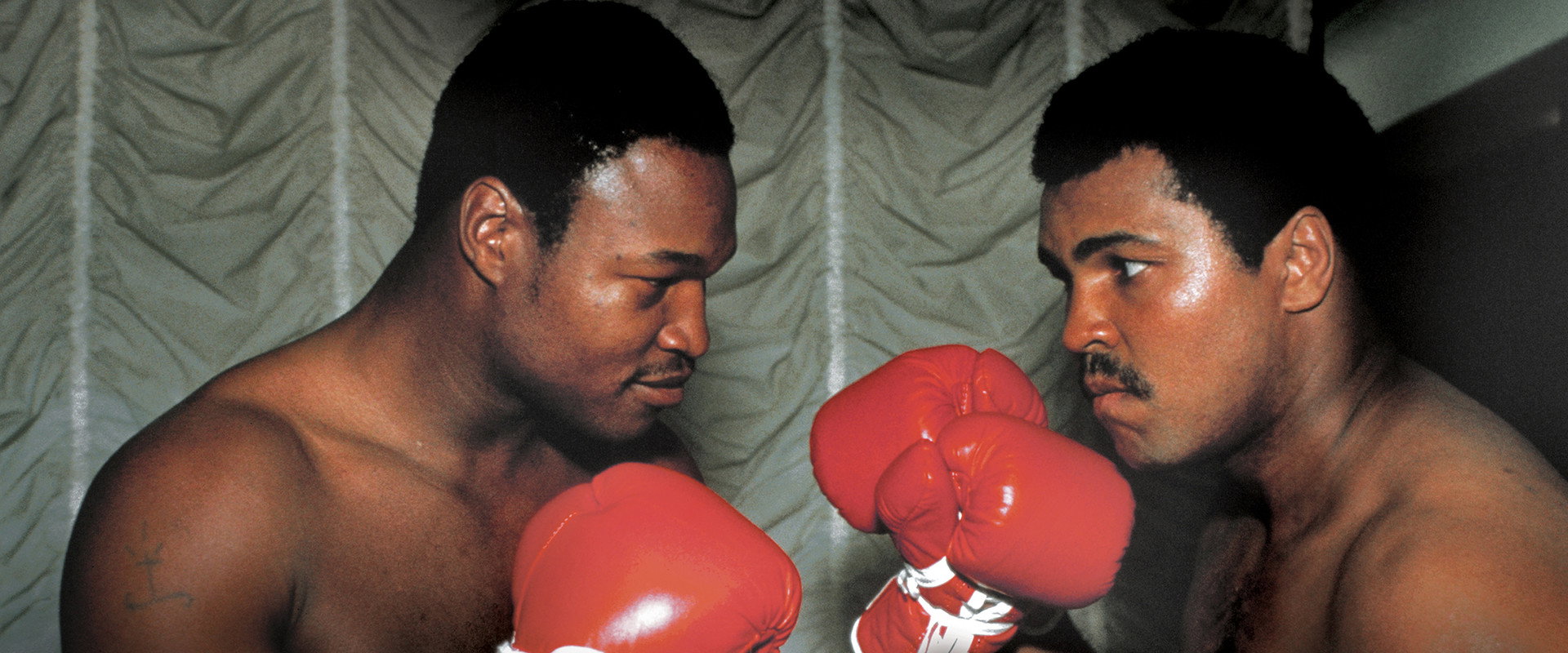 Muhammad and Larry backdrop