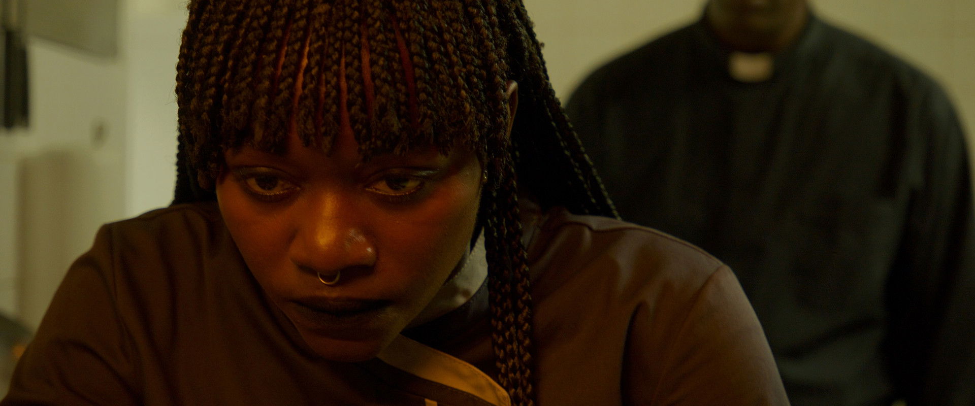 Our Father, the Devil backdrop