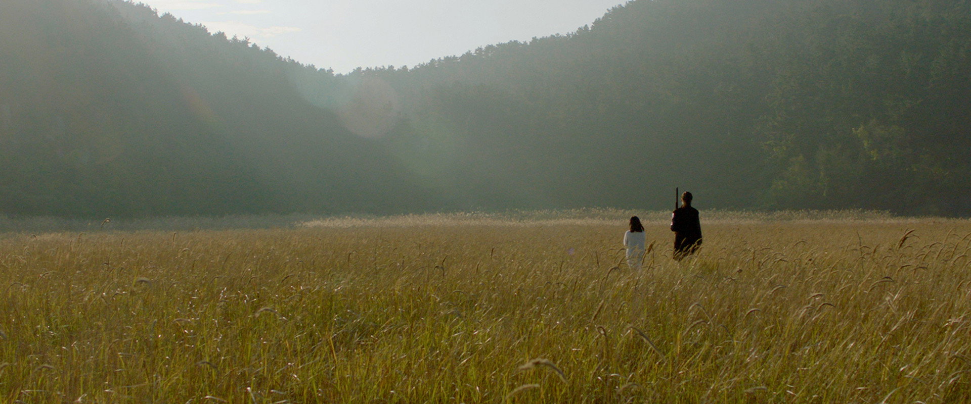 Skyrocket Junipers Under the Crescent backdrop