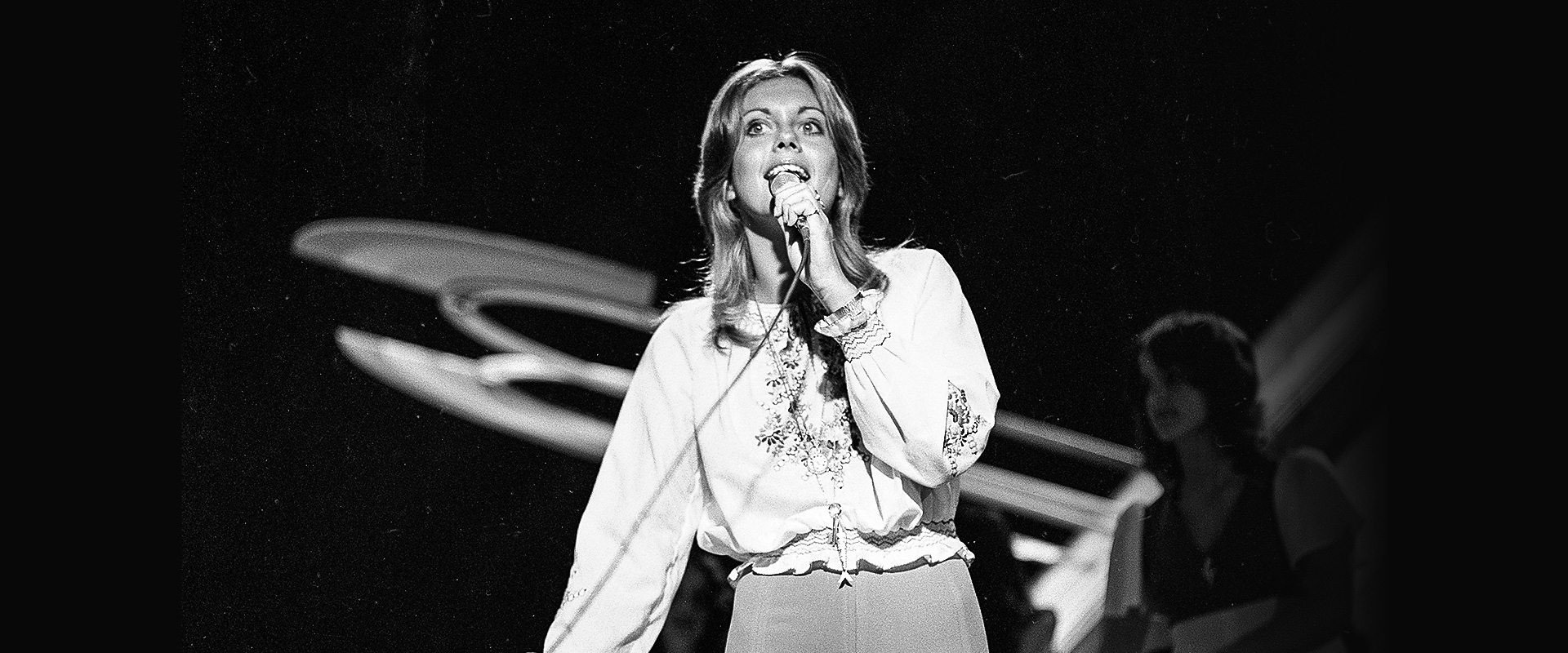 Olivia Newton-John at the BBC backdrop