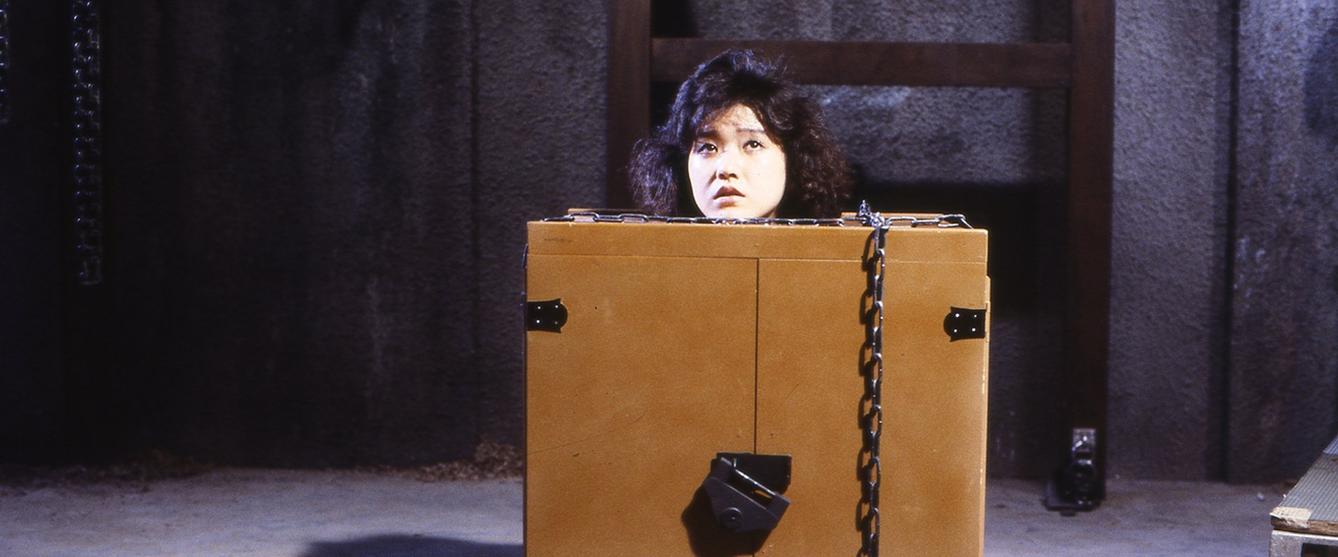 Woman in a Box: Virgin Sacrifice backdrop