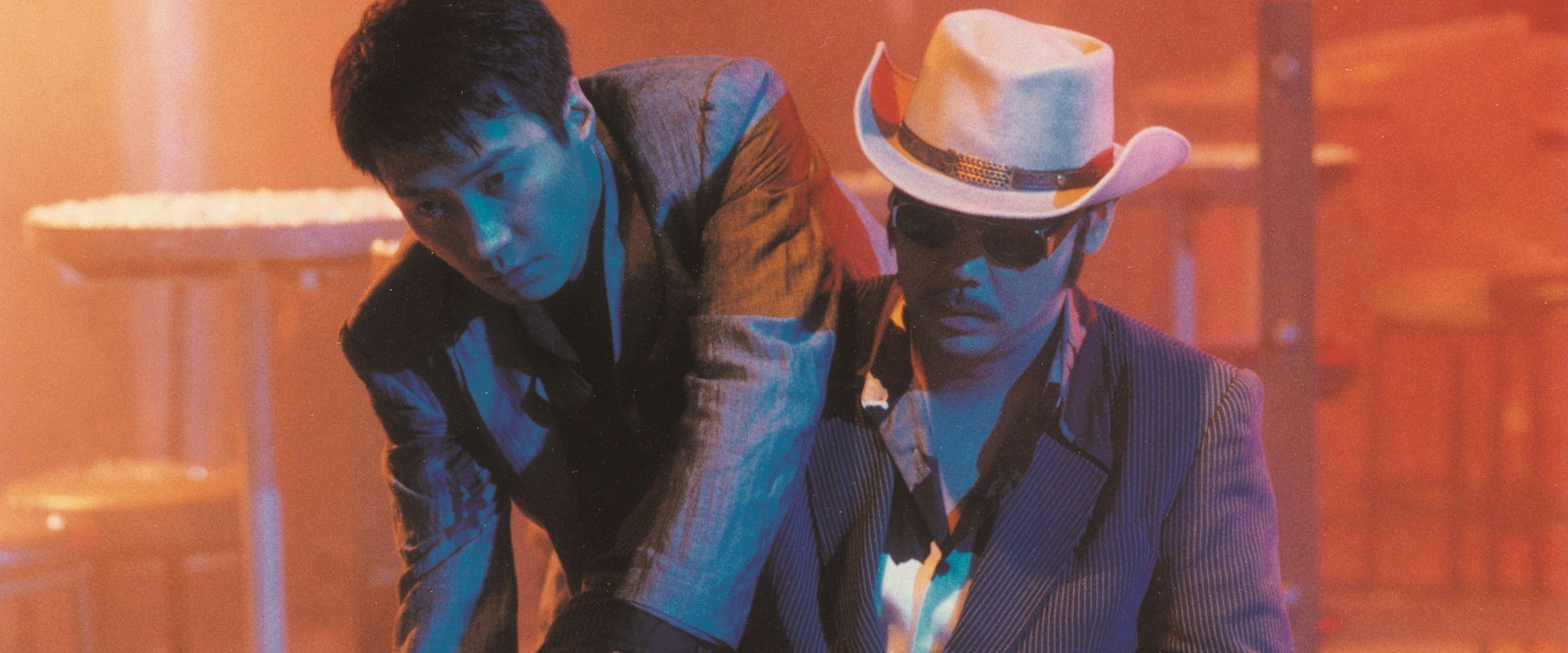 A Hero Never Dies backdrop