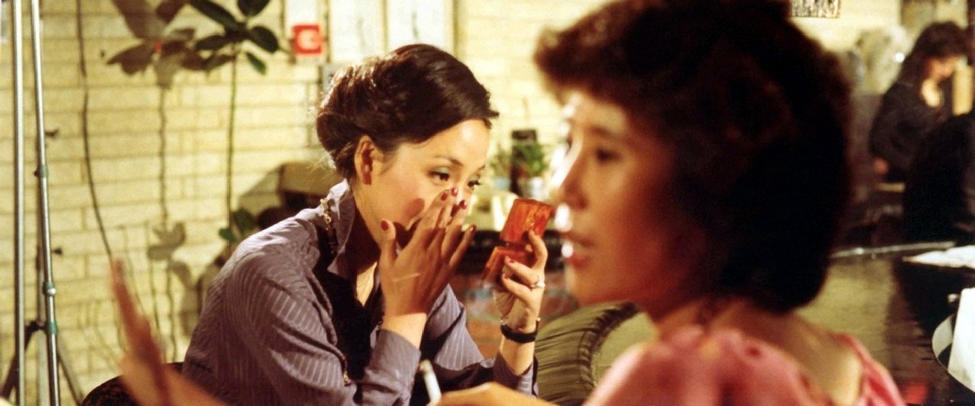 Three Women Under the Umbrella backdrop