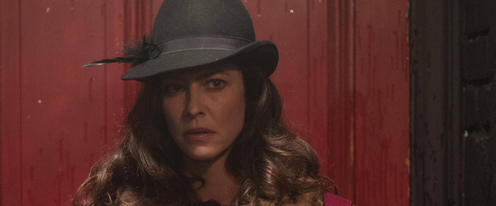 The Most Assassinated Woman in the World backdrop