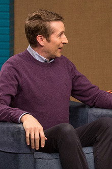 Chris Hardwick Wears a Black Polo & Weathered Boots