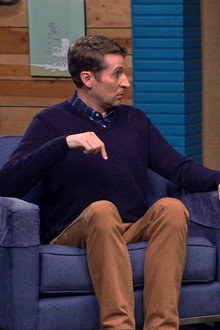 Tony Hawk Wears a Plaid Shirt & a Silver Watch