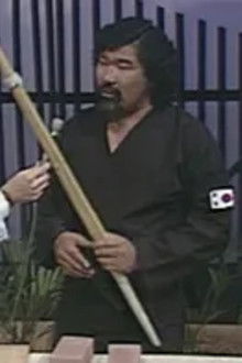 Andre the Giant sings with an oil drum band