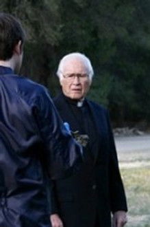 The Priest in the Churchyard