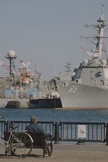 At a park in Yokosuka with a view of warships