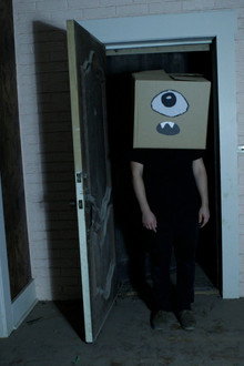 A Ghost and the Boy with a Box on His Head