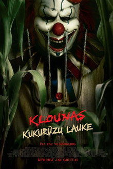Klounas kukurūzų lauke