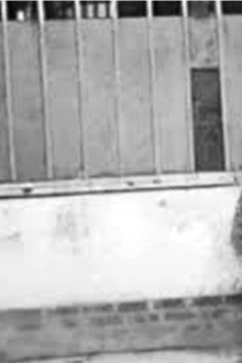 Man Walking Around a Corner