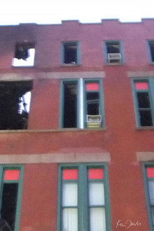 Brick Building with Red and Green Windows