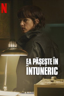 Ea pășește în întuneric