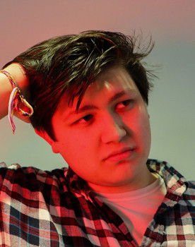 Alan Sanders as Man in car