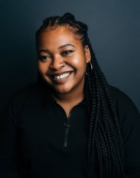 Kayla Meikle as Woman in suit