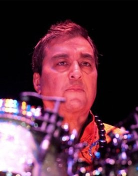 Kevin Ellman as Himself (Drums)