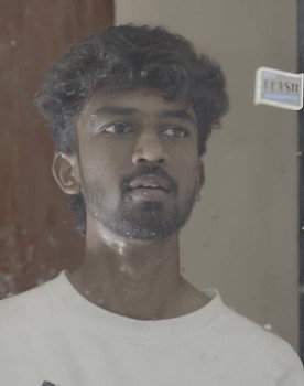 KARTHI as Anbu
