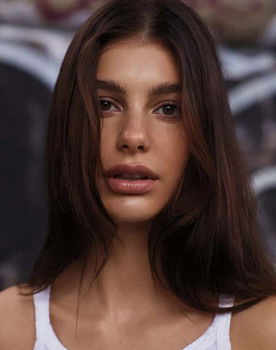 Camila Morrone as Mickey Peck