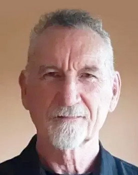 Bruce McFee as Prison Sign-In Guard