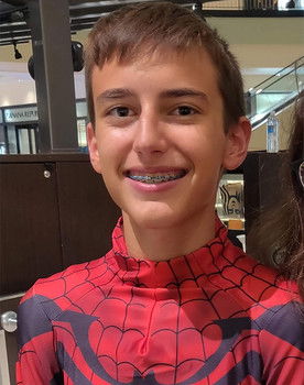 Joseph Long as The Man in the Suit