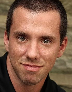 Erik Searle as Michael Adams