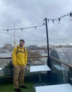 Caleb Thompson as Man on street