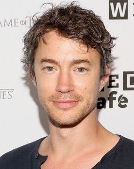 Tom Wisdom as Ian